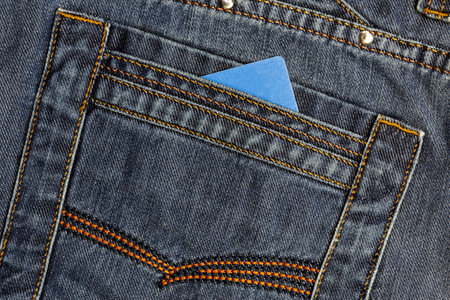 Unbranded plastic impersonal credit card for electronic transfer in jeans pocket, money and finance, payment methods, business conceptの写真素材