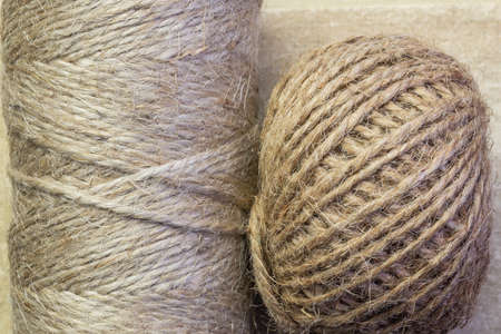 Twine rope jute and linen in bobbins, skeins close-up, household goods, production of belief...
