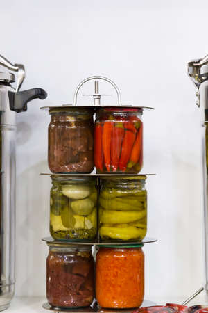 Sterilization of homemade pickled vegetable and meat canned food in glass jars stewed meat pepper...