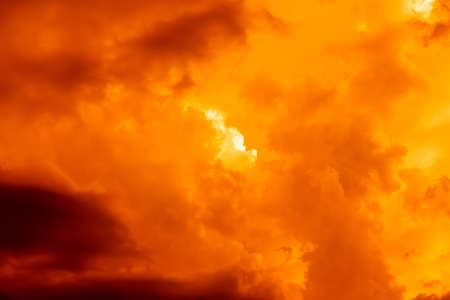 Fantastic concept mystical horror background from another planet from the paranormal world, fantasy style. Dramatic red black orange sky with scary hellish clouds and terrible shadows and light.の写真素材