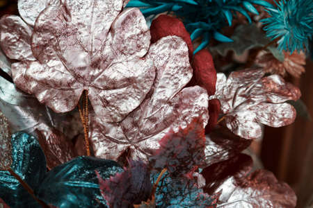 Floral plant background, texture turquoise pink artificial lush leaves.の写真素材