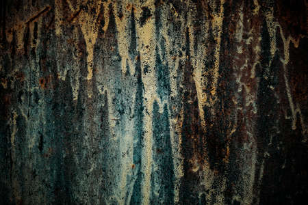 Horror background with grunge texture with black shadows and glow, strange scary dark rusty iron painted mystical mysterious old destroyed wall surface.の写真素材