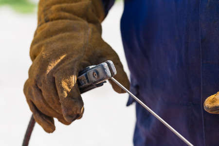 Profession welder, working specialty, equipment tool for welding metals electrode holder in the...