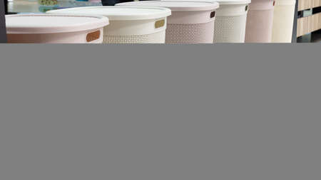 Assortment of different new empty plastic laundry baskets several. Variation of household goods.の写真素材