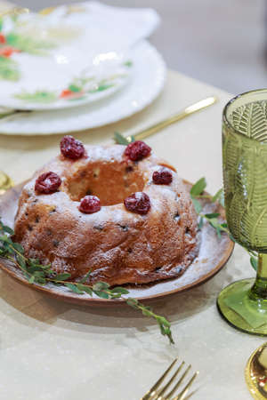Fresh homemade baked goods. Pie with cherries on a festive served table. Holiday dinner.
