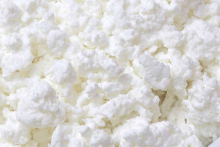 Dairy product farm, food background, texture of cottage cheese close-up.