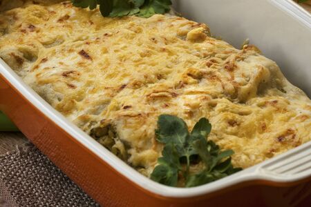 Cannelloni with spinach and ricotta baked in sauce bechamel in a panの写真素材