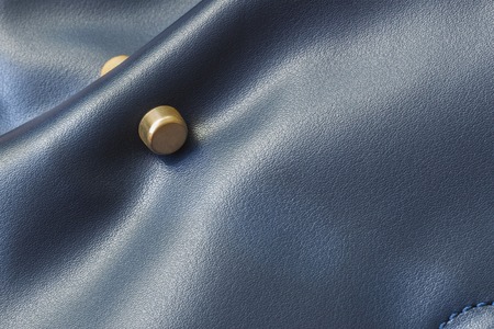 Metal detail of women's blue leather handbags close-upの写真素材