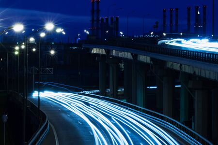 Light of city with blur focus. Night landscape with roads , buildings . Blur in blue tones