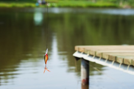 Plastic fishing lure for spinning - concept of active rest. Article about fishing and fish.の写真素材