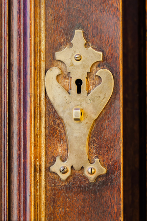 Detail of an old cabinet with brass lock, Retro look, idea of secretsの写真素材