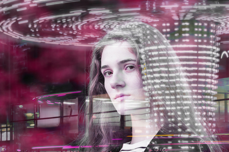 Portrait of a young intelligent girl on the background of city. Concept of business, education, future is now. Double exposureの写真素材