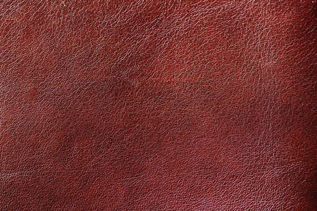 Texture of Genuine Leather shiny, antique, cracked, ,maroon color, background, surface.の写真素材
