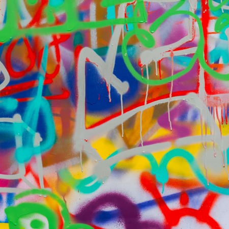 Beautiful street art graffiti closeup. Abstract creative drawing fashion colors on the wall of the...