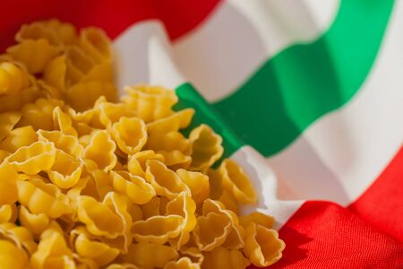 Dried Macaroni on the background of the Italian flag colors. for backdrop, substrate, composition useの写真素材
