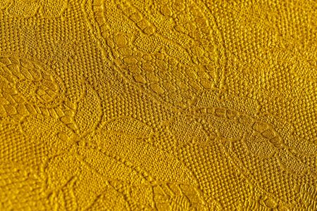 Genuine leather with an abstract ornament. Closeup on a leather texture. For modern pattern, wallpaper or banner design. With place for your textの写真素材