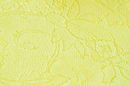 Genuine leather with an abstract ornament, tender light green color. Closeup on a leather texture. For modern pattern, wallpaper or banner design.の写真素材