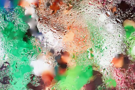 Abstract in bright colors design element with real light reflection for banner, print, template, web, decoration. Modern background in halftones with raindropsの写真素材