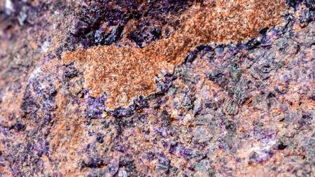 Rock stone with violet and brown tint textures, selective focus. For background , backdrop, substrate, composition use.の写真素材