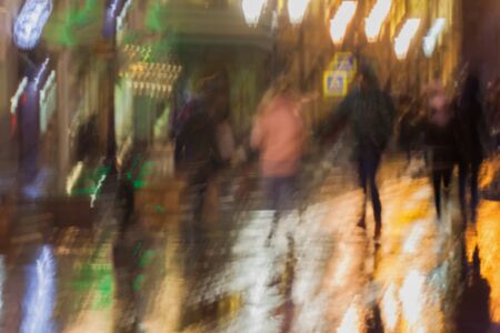 Abstract background of blurred young people walking down the street in rainy evening, Impressionism...