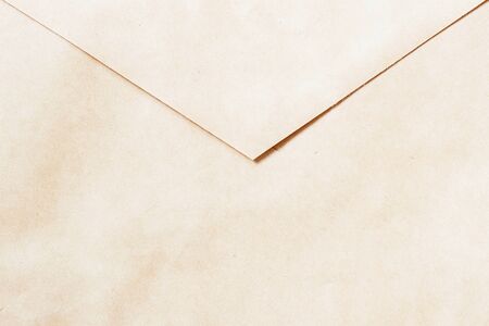 Texture of Vintage paper envelope, back side. Top view. Background , backdrop, substrate, composition use for design. With place for your textの写真素材