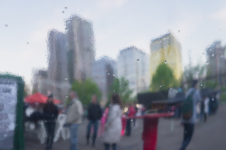 Distorted reflection of city and people on metal surface, reminiscent of art, watercolor, impressionism. Concept of modern city, lifestyle. Abstract blurred backgroundの写真素材