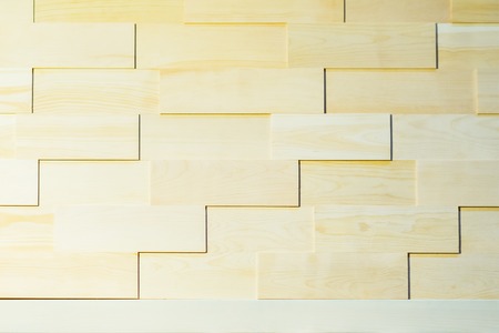 Wood plank wall ecological background for design and decoration, light natutal color. Decorative geomethrical rectangular wood pattern close-up. With place for textの写真素材