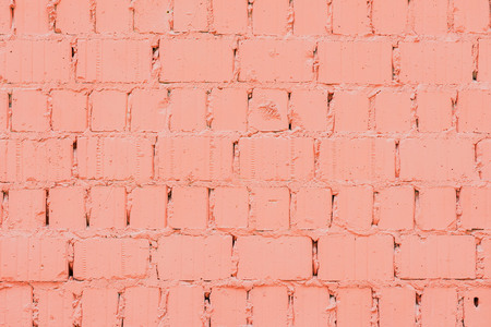 Vintage dyed brick wall with cracks, background and texture, natural design, patterns, extured background with space for text.の写真素材