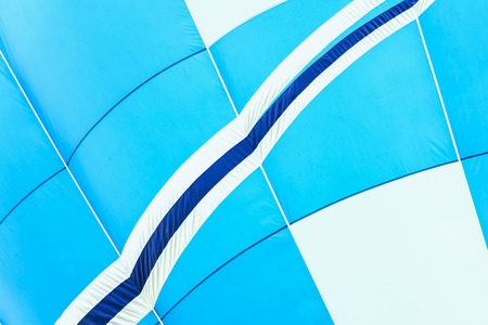 Close-up of hot air balloon vivid texture and pattern, blue-white colors. With place for your text, for modern backgroundの写真素材