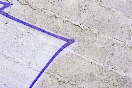 Abstract background from grungy dirty damaged cement wall. With remnants of paint and stains from graffiti. Urban background, space for textの写真素材