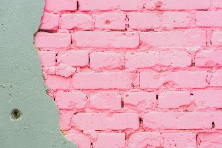 Beautiful abstract background from concrete and Painted pink brick wall texture urban background, space for text. Exposed brick on damaged wallの写真素材