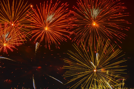 Bright golden glowing spheres and flickering stars, fireworks. Elegant background. New Year,...