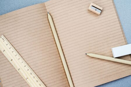 Craft notebook, wooden stationery items , top viewの写真素材