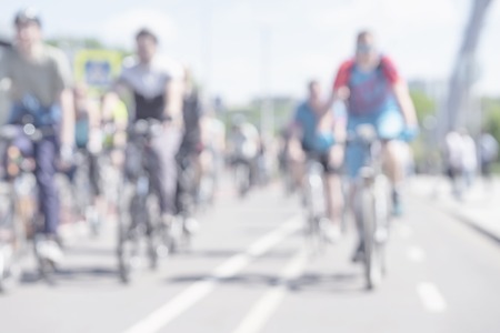 Group of unrecognizable cyclist cycling on the road in the countryside. Blurred light motion background. Healthy lifestyle, sport conceptの写真素材