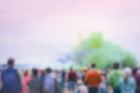 Large crowd of unrecognizable people back to us on bright show, an event with colorful smoke. Blurred backgroundの写真素材