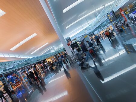 BARCELONA, SPAIN - June 08, 2019. El Prat Josep Tarradellas Airport. Public area at the Terminal T1. Passengers, waiting for flights, modern airport with duty free shopsのeditorial素材