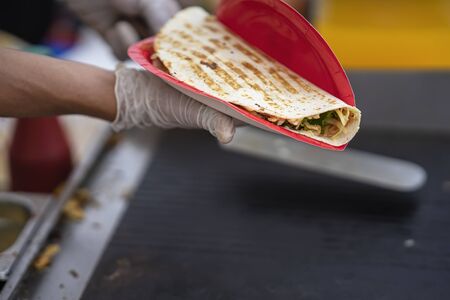 Hands of hands of chef making healthy fresh tortilla for fajitas or fajitos. National food, fresh...