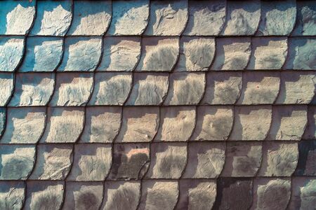 Texture of the colored layered wall, similar to a decorative tile, modern backgroundの写真素材