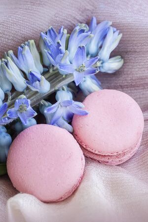 Pink macarons, macaroons, spring flowers, top view. Romantic morning. Breakfast on Valentin's, Mothers, Women's dayの写真素材