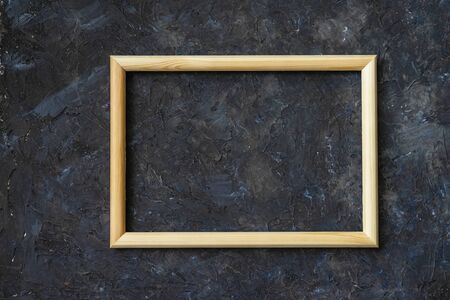 Classic wooden frame mockup on dark dirty wall, for background