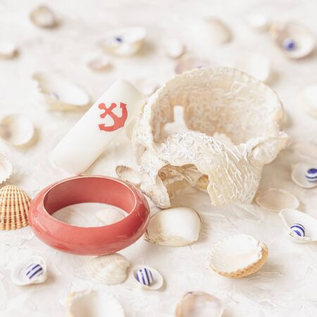 Set of different seashells and bracelet with anchor, summer jewelry, top view, summer vacation...