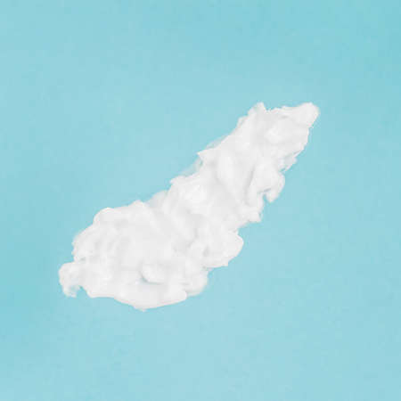 Smear of Cosmetic cream for face and body on blueの写真素材