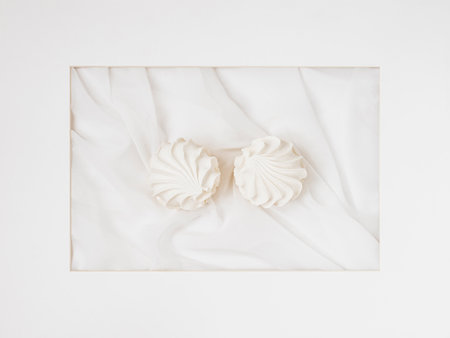 White apple marshmallows, zephyr in frame, flat lay, abstract sweet artの写真素材