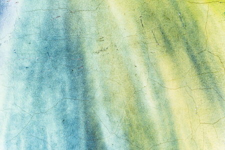 Old painted grunge cracked wall, vintage background, texture of green blue plaster