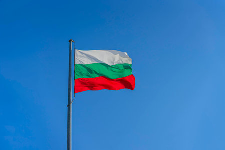 National flag of Bulgaria waving in the wind against a clear blue skyの写真素材