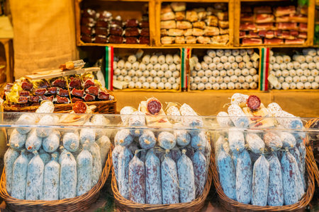 Artisanal sausages in rustic baskets on market stall. Concept of traditional food, local delicaciesの写真素材