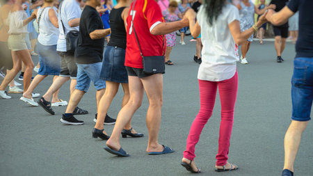 Group of people performing a traditional Bulgarian folk dance Horo. Horo is a communal dance in...