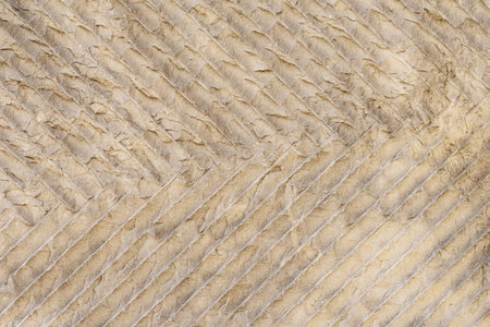 Wall background surface with diagonal folds forming abstract textured background. Concept of...