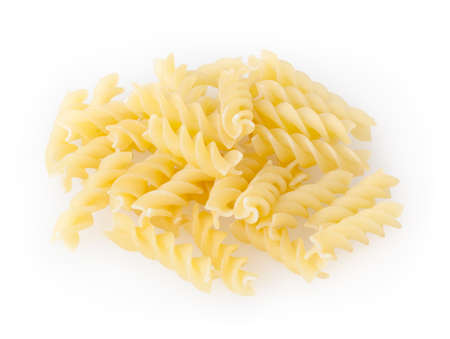 Uncooked fusilli pasta isolated on white backgroundの写真素材