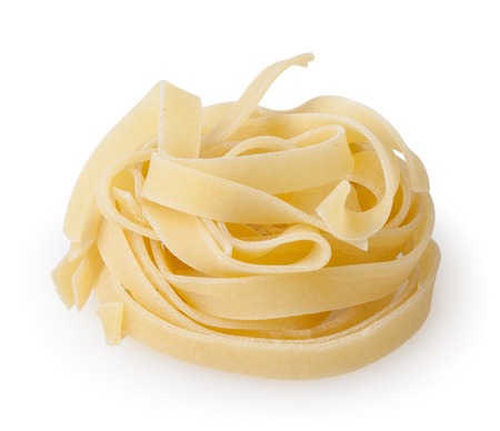 Uncooked nest of tagliatelle pasta isolated on white backgroundの写真素材